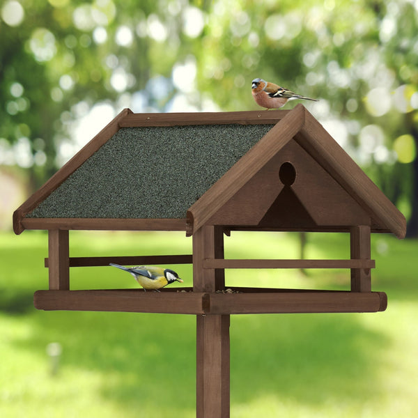 Mangeoire à oiseaux marron sur pied